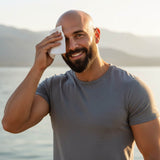 Man using Beard Bro™ Dome Wipes to clean and refresh his bald head – cooling mint formula for hydrated, smooth scalp.