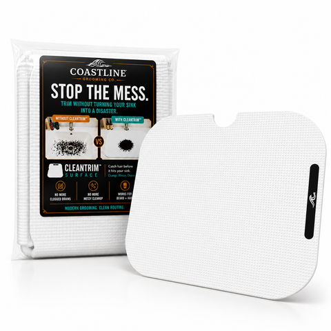 “Mess-free beard trimming setup with grooming mat protecting bathroom sink and countertop from hair clippings.”