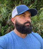 Navy blue and white Dry-Core sweat-proof performance hat in black, designed with moisture-blocking technology, breathable fabric, and a sleek, structured fit for active wear. 