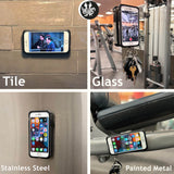 Phone attached to a mirror with the Octo Bite keychain mount for hands-free video recording at the gym. Octo-Bite also holds your keys.
