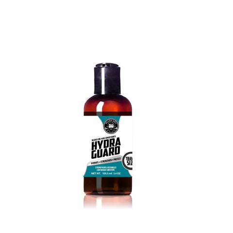 Beard Bro Hydra Guard Beard and Hair Conditioner travel-size bottle with classic barbershop design in teal, black, and white. Features the Beard Bro logo and bold text reading ‘Hydrate • Strengthen • Protect.’ Designed to moisturize, detangle, and protect dyed, dry, or damaged hair and beards.