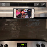 suction cup phone mount attaches to a mirror, glass, metal, with the Octo Bite keychain mount for hands-free video recording at the gym.